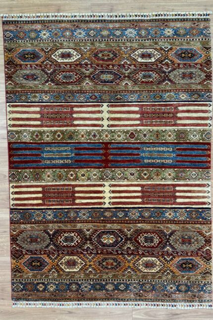Aryana Handmade Rug Wool Multi 239X174 The multi-coloured palette of this rug adds a dynamic and playful touch to any room, creating a focal point that enhances the ambiance of your space. Whether displayed in a modern living room or a traditional study, the lively hues effortlessly complement a variety of interior styles. Measuring 239x174 cm, this rug is perfectly sized to anchor your seating area or serve as a statement piece in your bedroom or hallway. Its plush pile provides comfort underfoot while adding texture and visual interest to your floors. Enhance your home with the vibrant beauty and craftsmanship of the Aryana Handmade Rug. Whether displayed in a contemporary or classic setting, this exquisite rug adds energy and charm to your living space, making it a cherished focal point of your decor.