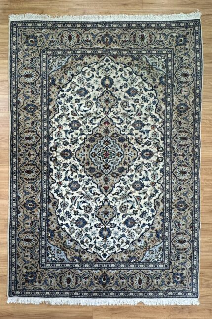 "Indulge in luxury with this Persian Kashan handmade rug. Crafted from super fine wool in a sophisticated cream and brown palette, measuring 310X200."